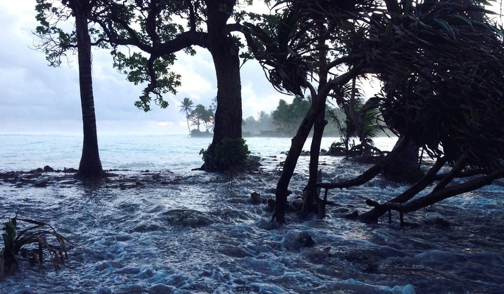 A storm surge washes across Ejit Island in Majuro Atoll, Marshall Islands. Photo: AFP A storm surge washes across Ejit Island in Majuro Atoll, Marshall Islands. Photo: AFP