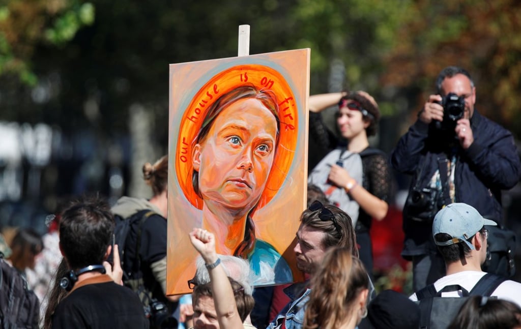 Swedish climate activist Greta Thunberg was an icon of the Fridays for Future protest – which took on September 20 ahead of Paris Fashion Week – invoked in this painting, titled Our House Is On Fire (Our Children Will Burn) by artist Julia Vanderbyl. Photo: Reuters