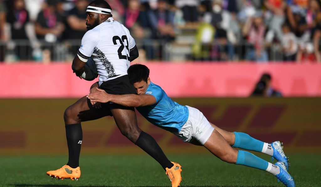 Fiji's centre Levani Botia is tackled by Uruguay's centre Juan Manuel Cat. Photo: AFP Fiji's centre Levani Botia is tackled by Uruguay's centre Juan Manuel Cat. Photo: AFP