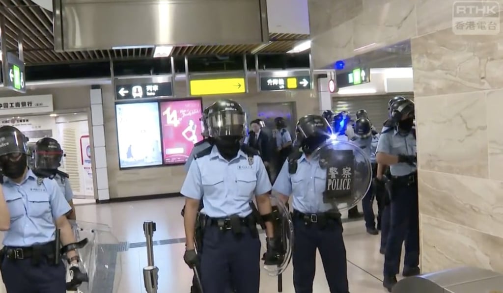 Riot police arrive in Sha Tin station. Photo: RTHK
