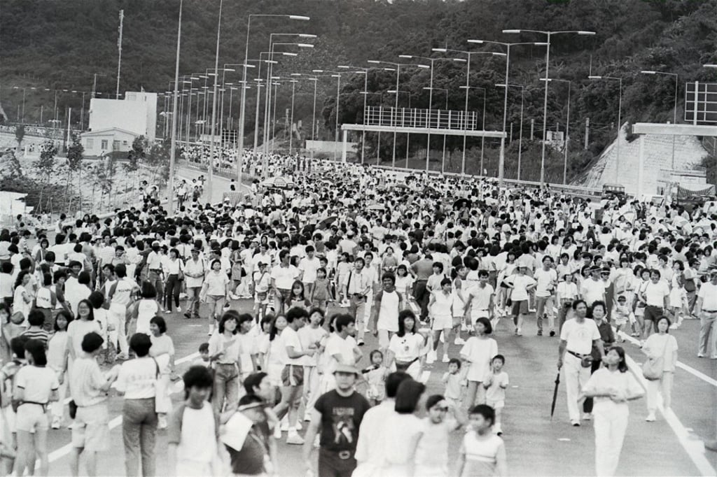 Participants in a charity walk on the Tolo Harbour coastal highway, which links Sha Tin with Tai Po, in September 1985.