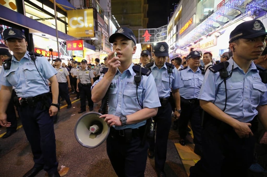 Since 2004 the Hong Kong police force have worn a light-blue shirt and black trousers. Photo: Dickson Lee