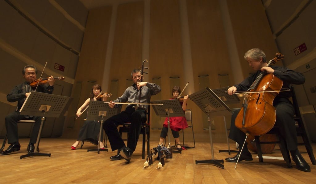 Chinese erhu virtuoso Xu Ke (front centre) with members of the Tokyo String Quintet, who will be performing together in Hong Kong in December.