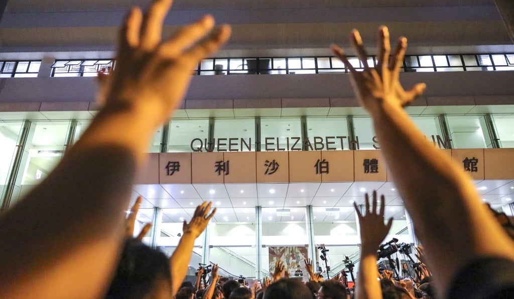 Protesters gather outside the stadium. Photo: May Tse