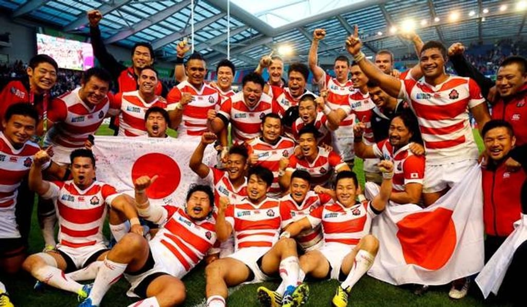 Japanese players celebrate their ‘Brighton Miracle’ victory over South Africa. Photo: Handout.