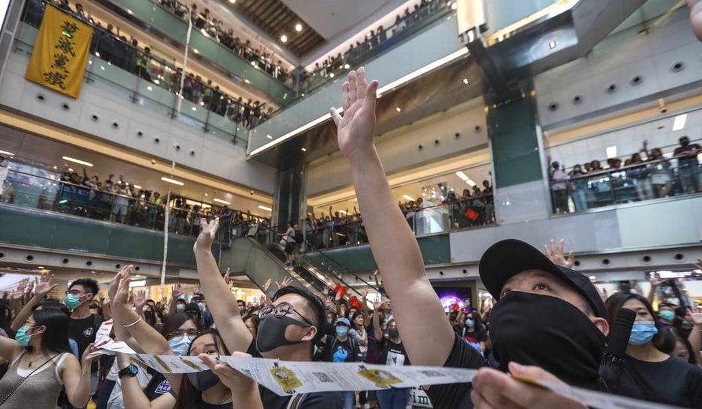 Protesters sing during a rally in New Town Plaza in Sha Tin. Photo: Nora Tam