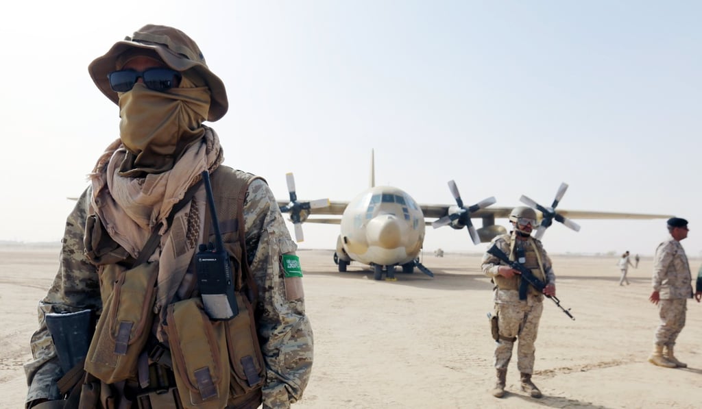 Saudi soldiers guard a military cargo plane at an airfield in the eastern province of Marib, Yemen. File photo: AP