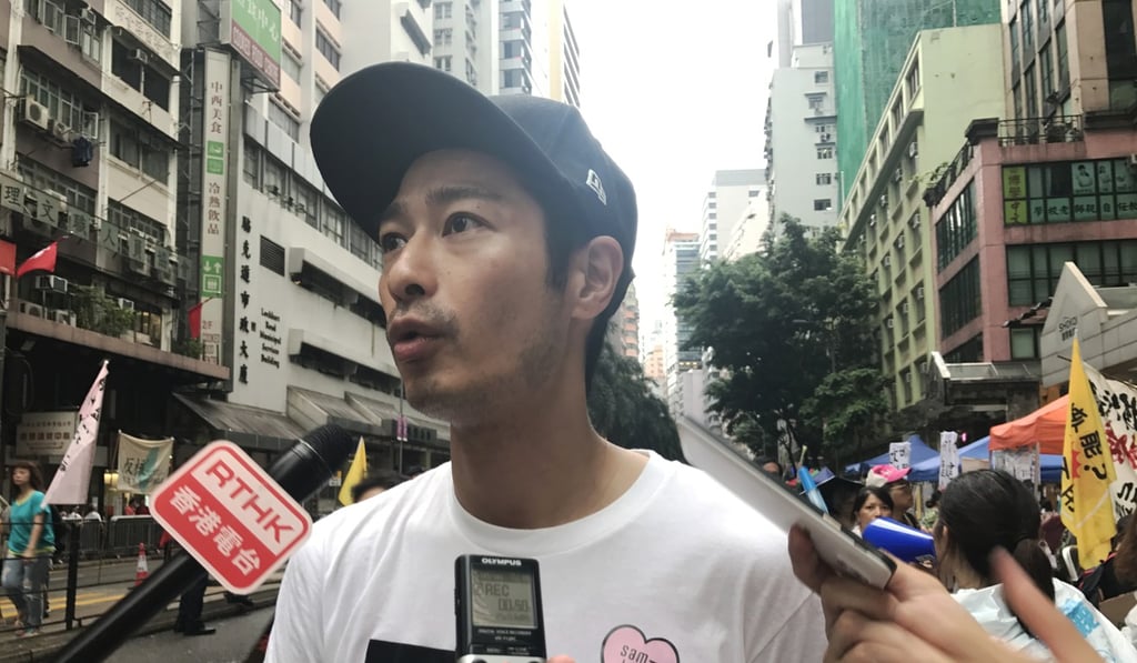 Gregory Wong, pictured talking to the media during a July 1 march, is among those said to have been arrested over the incursion into the Legislative Council that day. Photo: SCMP