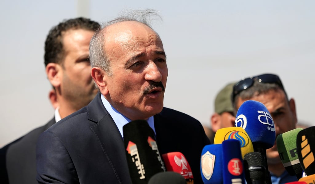 Syrian Interior Minister Major General Mohammed Khaled Rahmoun speaks during the reopening of the border crossing. Photo: Reuters Syrian Interior Minister Major General Mohammed Khaled Rahmoun speaks during the reopening of the border crossing. Photo: Reuters