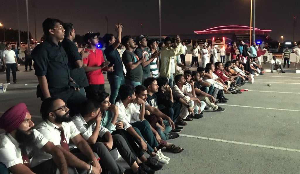 Indian fans who could not get tickets watch a soccer match on a screen outdoors in Qatar. Photo: AFP Indian fans who could not get tickets watch a soccer match on a screen outdoors in Qatar. Photo: AFP