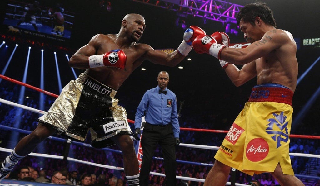Floyd Mayweather on the offensive against Manny Pacquiao in their 2015 Las Vegas fight. Photo: Handout