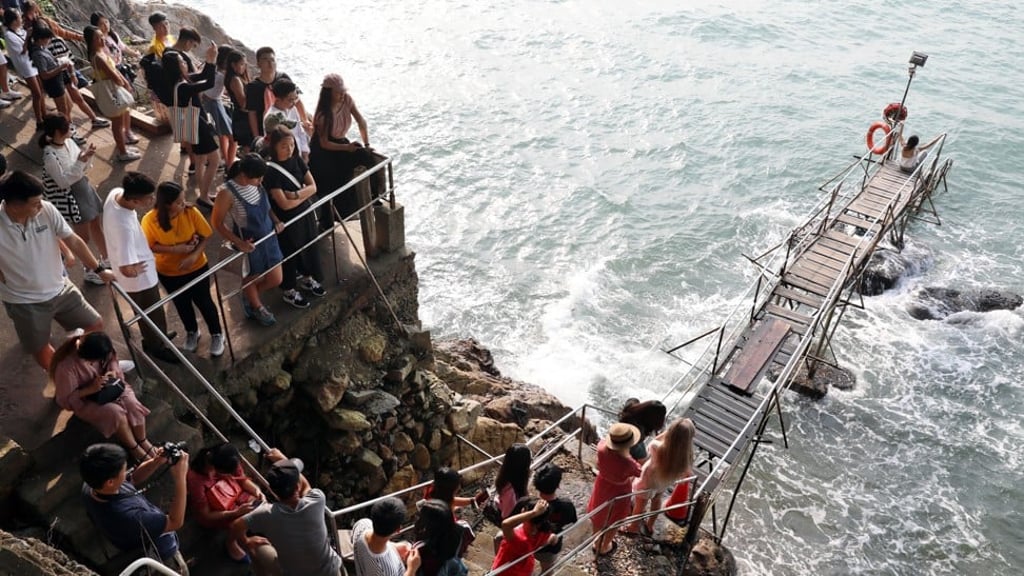 People queue at the Swimming Shed in Sai Wan, the last of its kind in Hong Kong. Photo: Robert Ng