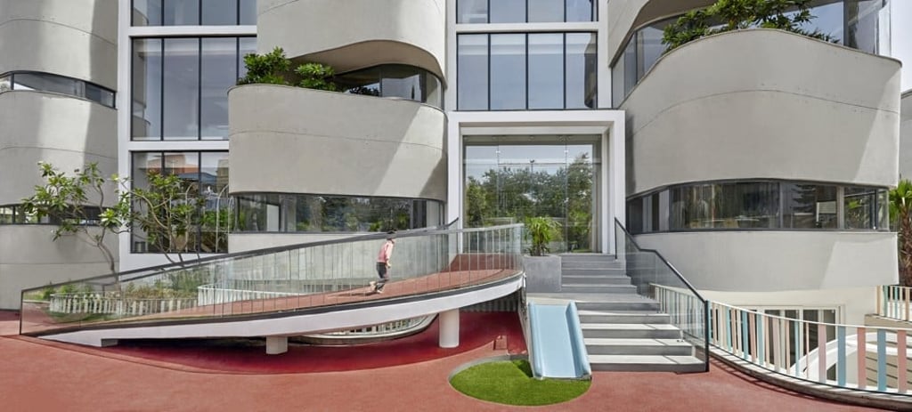 Rubber matting, a ramp and a slide at the entrance to the preschool.