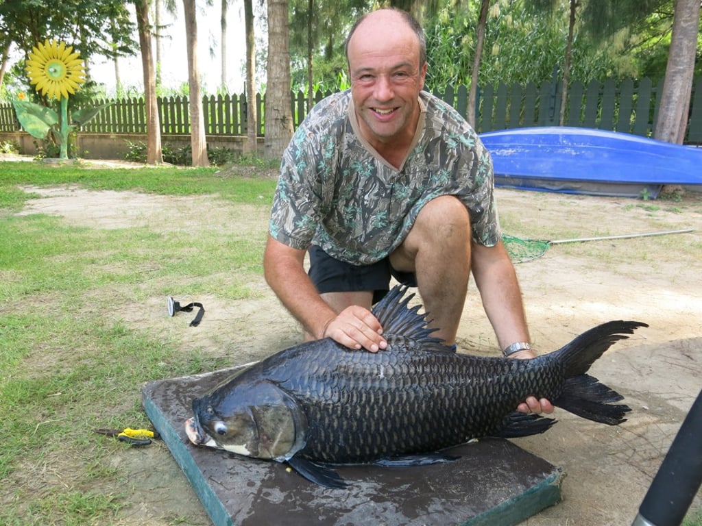 Mike Sharp with a Siamese Carp. Photo: Handout