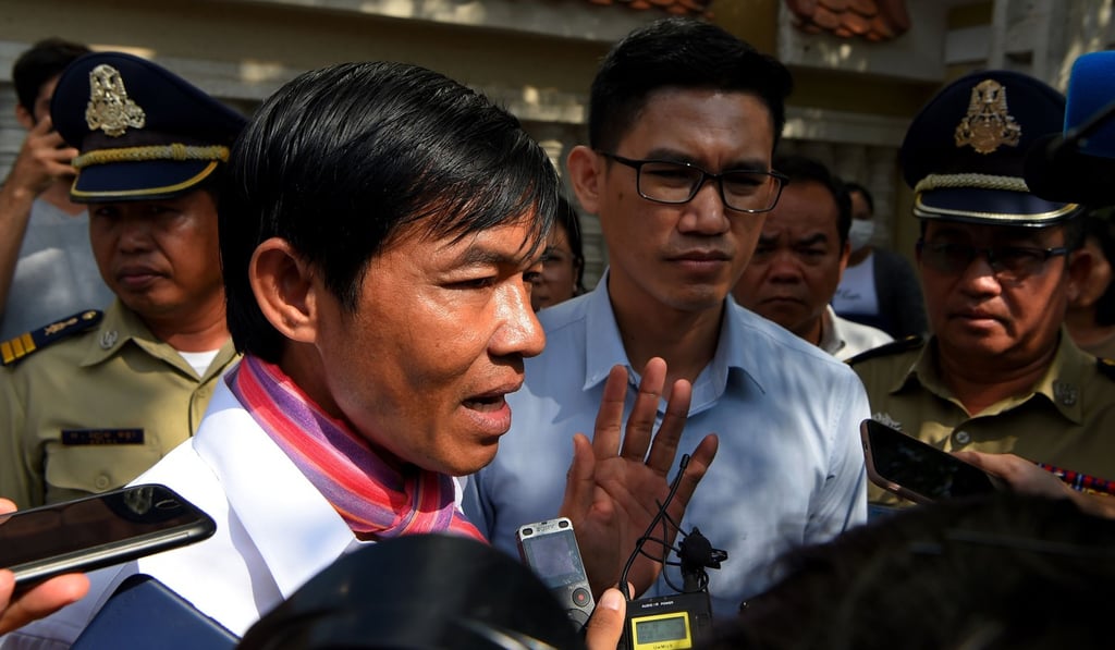 Uon Chhin and Yeang Sothearin speak to the media outside court. Photo: AFP