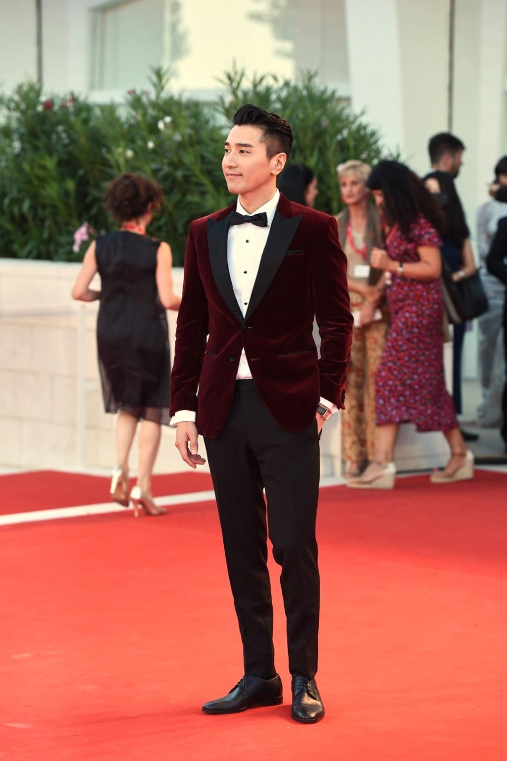 Actor Mark Chao wears a chic burgundy tuxedo from Hugo Boss’s pre-spring 2020 collection.