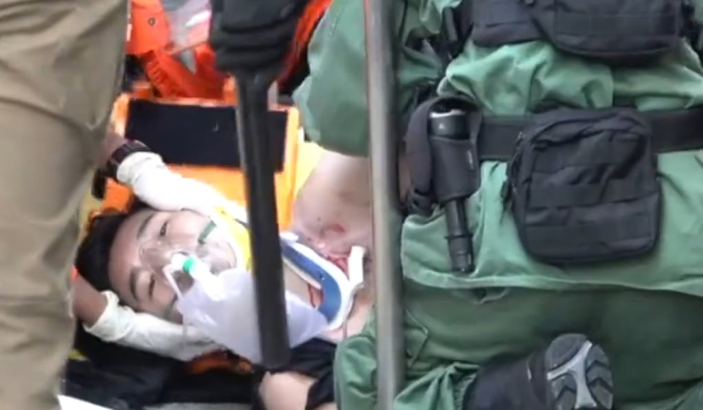 A protester in Hong Kong is taken to hospital after being shot by a police officer. Photo: Handout