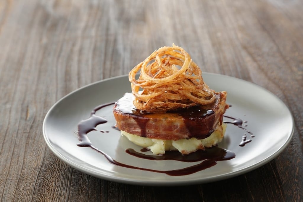 Comfort food: a bacon-wrapped meat loaf at Wolfgang Puck Kitchen.