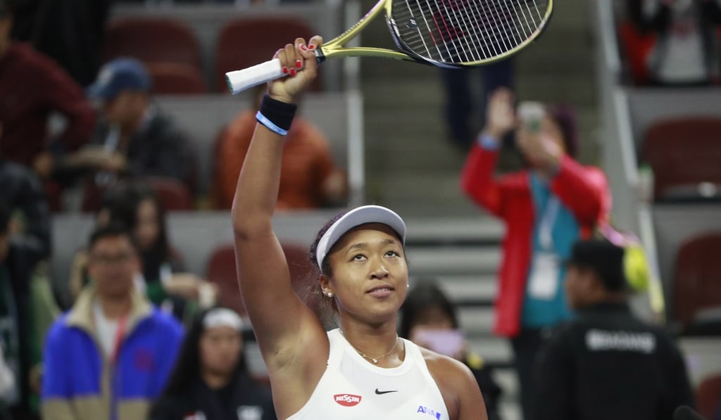 Naomi Osaka waves to the crowd after winning the China Open final. Photo: EPA Naomi Osaka waves to the crowd after winning the China Open final. Photo: EPA