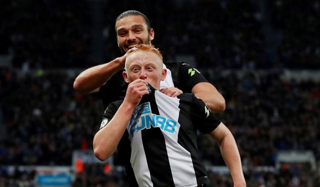 Matty Longstaff celebrates scoring his first goal for Newcastle United with Andy Carroll. Photo: Reuters