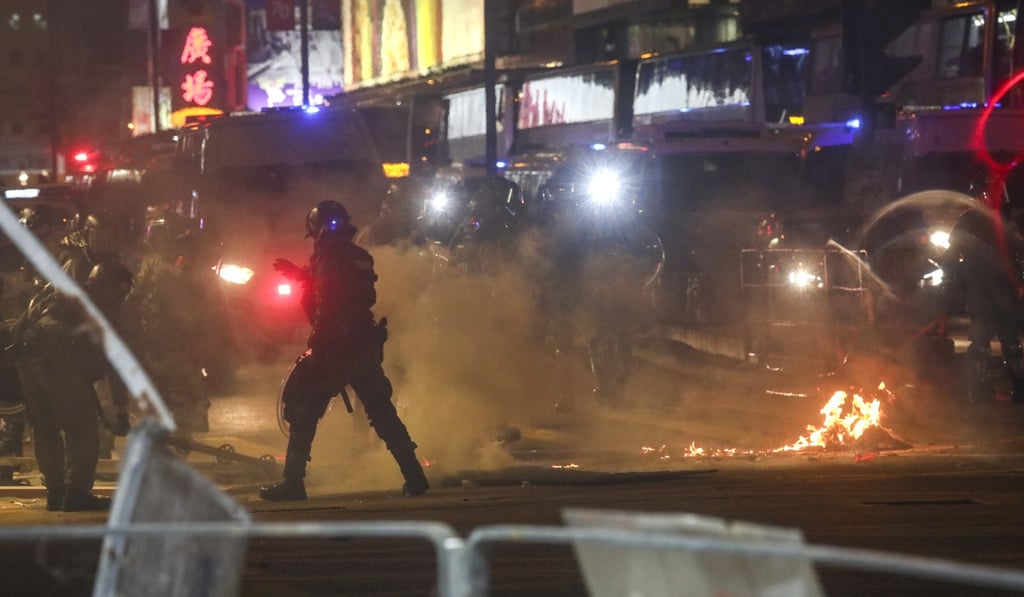 Riot police in Mong Kok. For the first time, Hongkongers could be going to the polls during a period of raging unrest. Photo: Jonathan Wong
