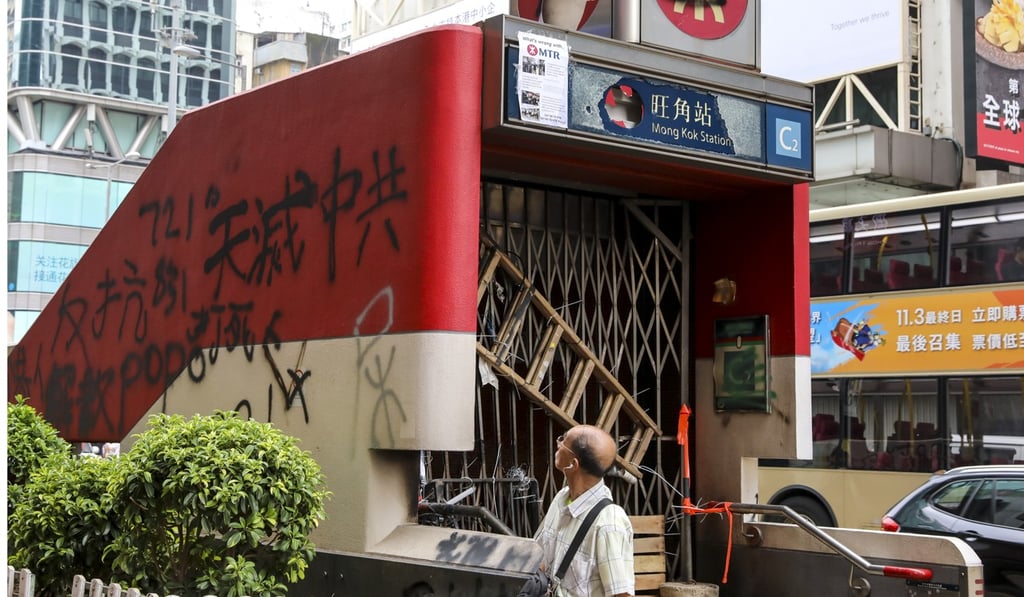 Protesters vandalised and destroyed an entrance to the Mong Kok MTR station during a rally in defiance of the anti-mask law on Sunday. Photo: K.Y. Cheng Protesters vandalised and destroyed an entrance to the Mong Kok MTR station during a rally in defiance of the anti-mask law on Sunday. Photo: K.Y. Cheng