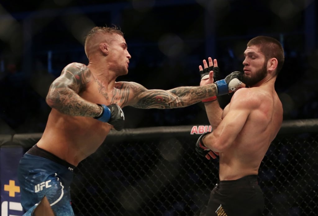 American mixed martial artist Dustin Poirier (left) goes on the attack during his defeat by Russian Khabib Nurmagomedov during a UFC lightweight title fight. Photo: Reuters American mixed martial artist Dustin Poirier (left) goes on the attack during his defeat by Russian Khabib Nurmagomedov during a UFC lightweight title fight. Photo: Reuters