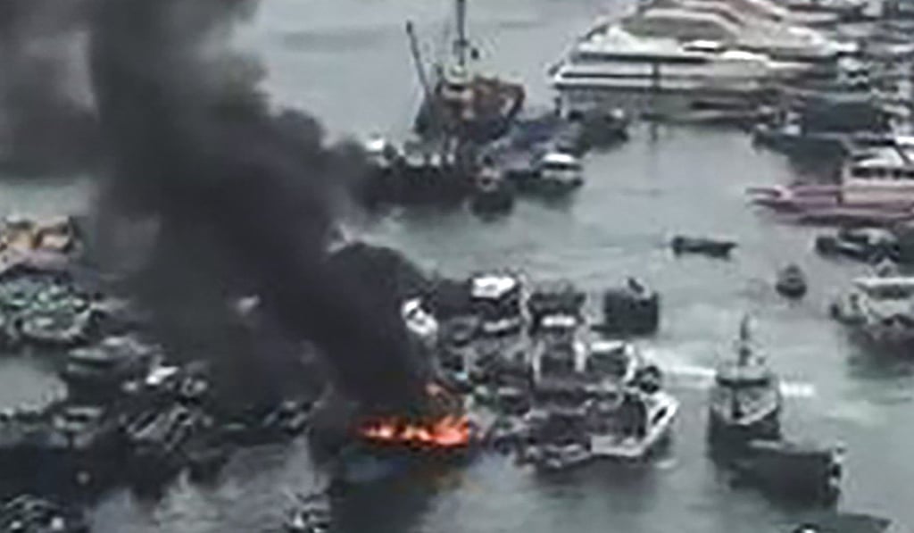 Black smoke rises from the fire on the boat. Photo: Facebook