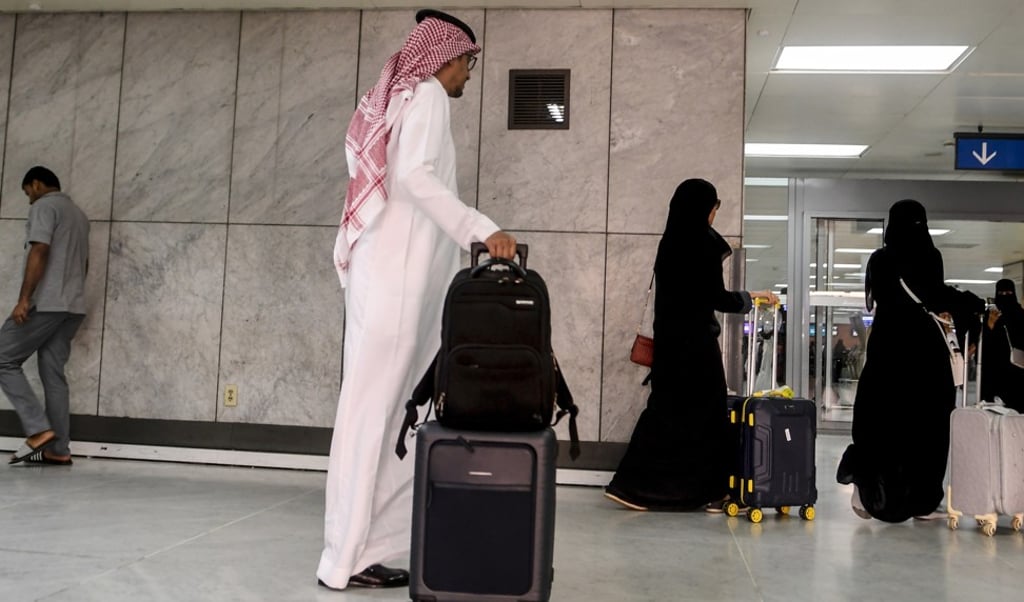 Saudi women rolling their suitcases at the departure hall of the Jeddah Airport on August 6. Saudi Arabia’s easing of travel restrictions on women drew anger from hardliners backing contentious male “guardianship” rules. Photo: AFP