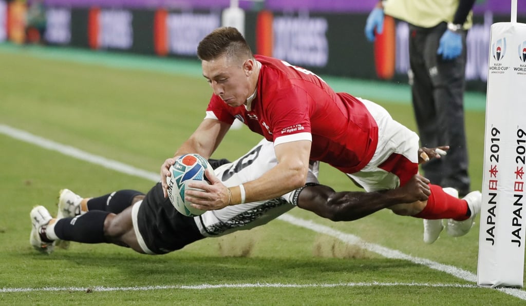 Josh Adams touches down for Wales. Photo: Kyodo Josh Adams touches down for Wales. Photo: Kyodo