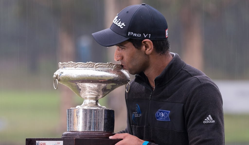 Aaron Rai of England poses with the trophy after winning the Open last year. Photo: EPA
