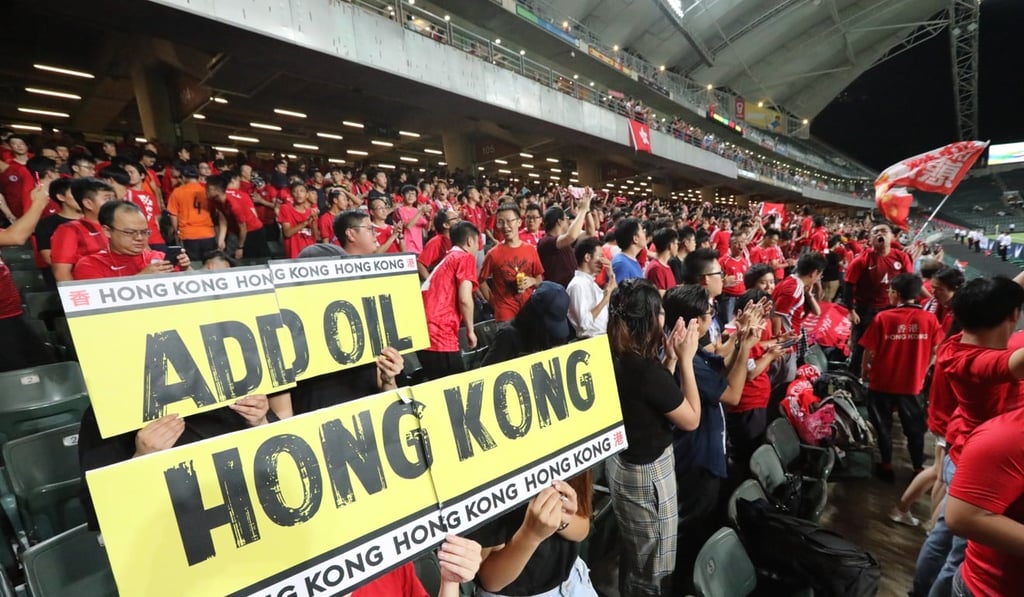 Fans support the protest movement at the Hong Kong v Iran game. Photo: Felix Wong