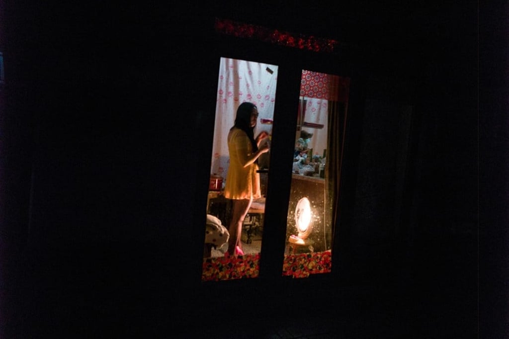 A sex worker waiting for clients in Beijing. Photo: AFP