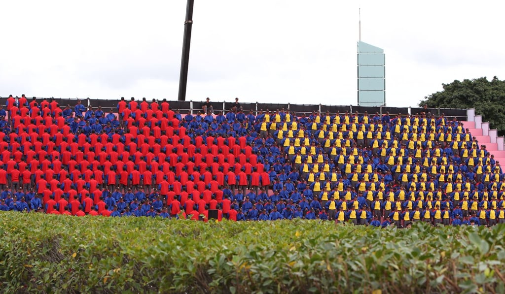 Participants in colour-coordinated outfits form the