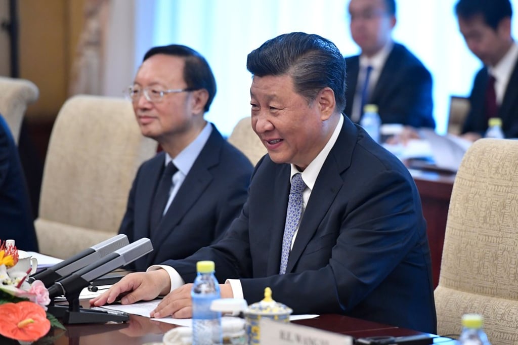 Chinese President Xi Jinping speaks with Pakistan's Prime Minister Imran Khan (not pictured) during their meeting at the Diaoyutai State Guesthouse in Beijing on October 9, 2019. Photo: AFP
