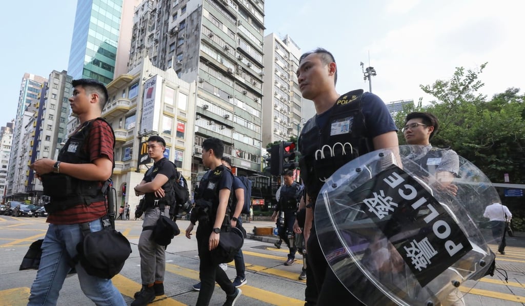 Police officers hit the streets of Tsim Sha Tsui. Photo: Dickson Lee