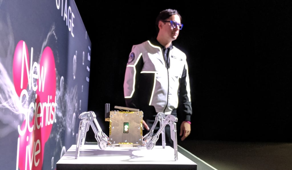 Spacebit founder Pavlo Tanasyuk poses next to his new lunar rover in London on Thursday. Photo: Reuters