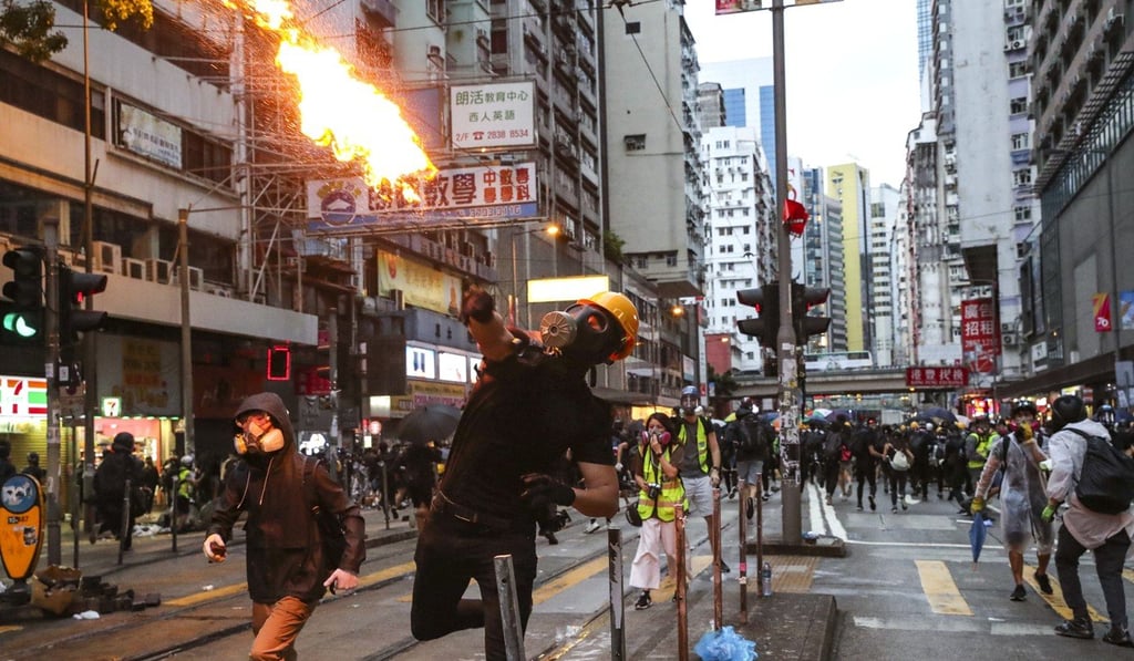 Swathes of Hong Kong have turned into fire-strewn battlegrounds in more than four months of anti-government unrest, but security chief John Lee says he is the person to lead the city’s return to peace. Photo: Sam Tsang