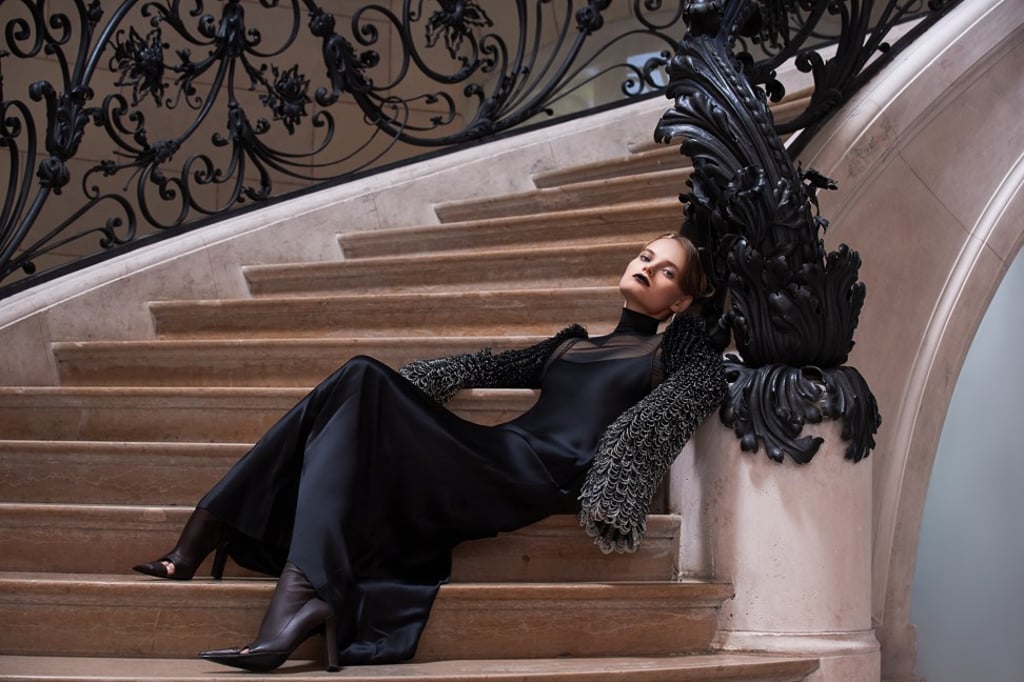 Schiaparelli haute couture bias dress in black with heeled boots.