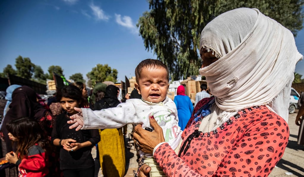 Displaced Syrians, who fled their homes in the border town of Ras al-Ain, the first town to fall to Turkey’s forces since the launch of its cross-border offensive earlier in the week. Photo: AFP