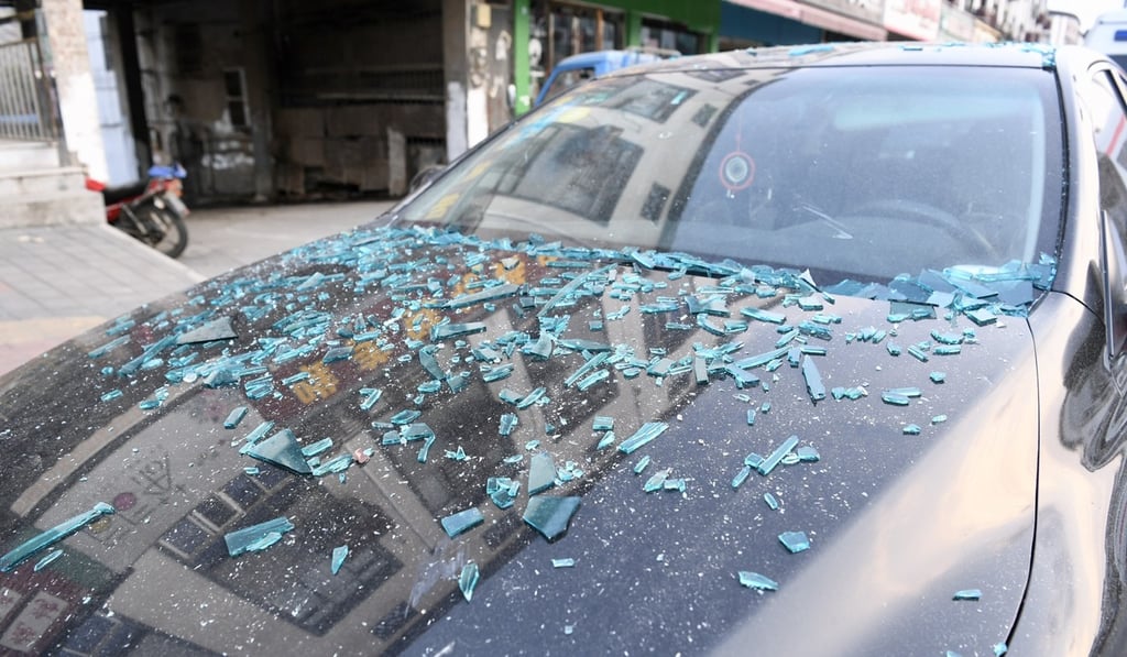 The basement gas explosion at a restaurant in Wuxi sent shards of glass into the street. Photo: Xinhua