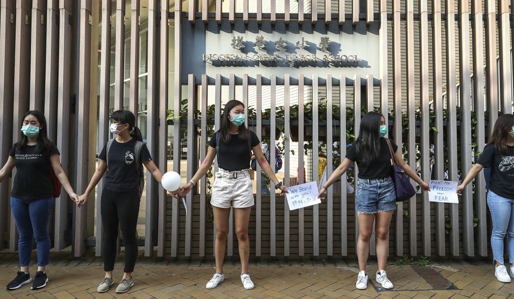 Students from Diocesan Girls’ School form a human chain during a protest last month. Photo: Winson Wong