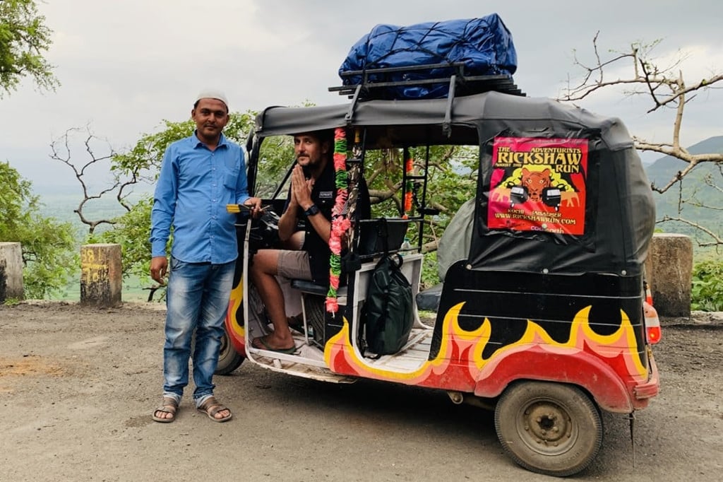A temple guardian gives out a blessing on the way into Rajasthan, India. Photo: David Burden