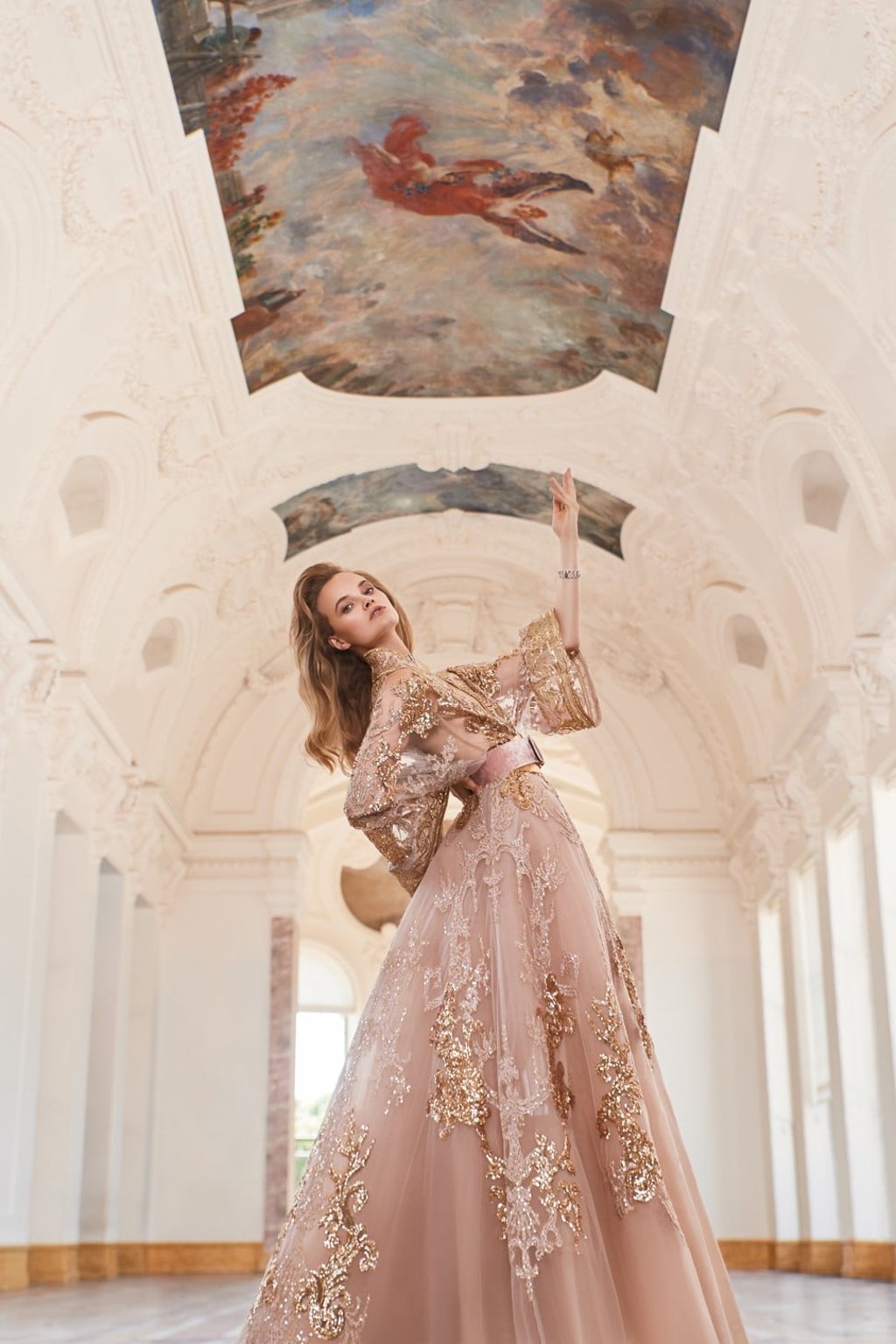 Elie Saab haute couture long embroidered tulle dress with double belt; Damiani necklace and bracelet from the Damianissima collection.