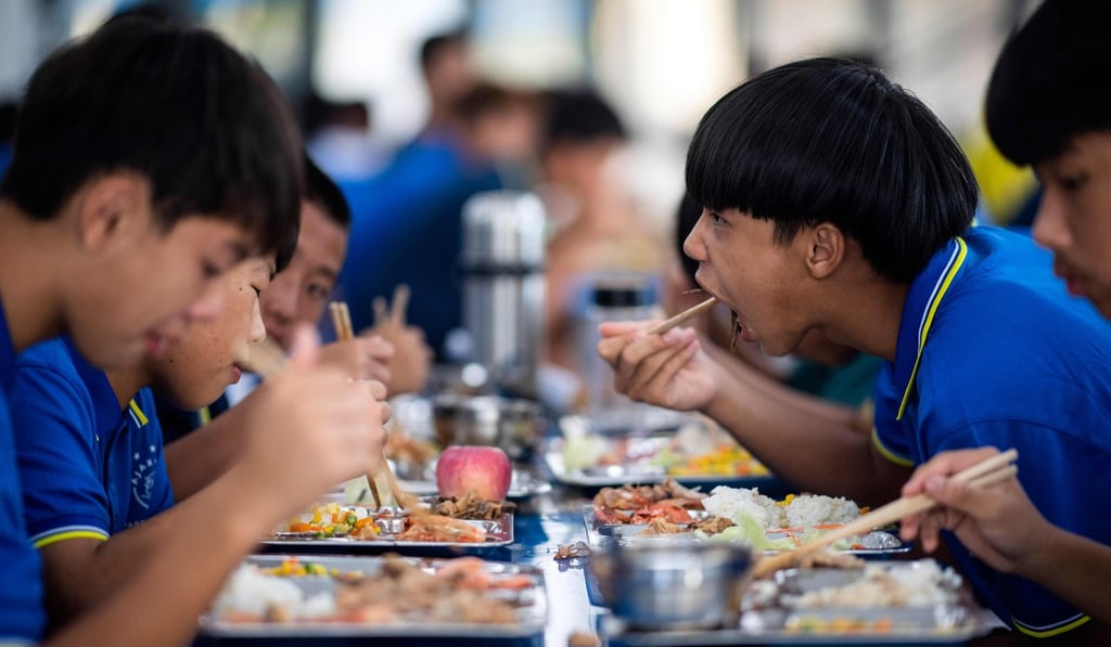 Schoolboys eating lunch at the Guangzhou R&F Football Academy in Meizhou in southern China’s Guangdong province. Photo: AFP