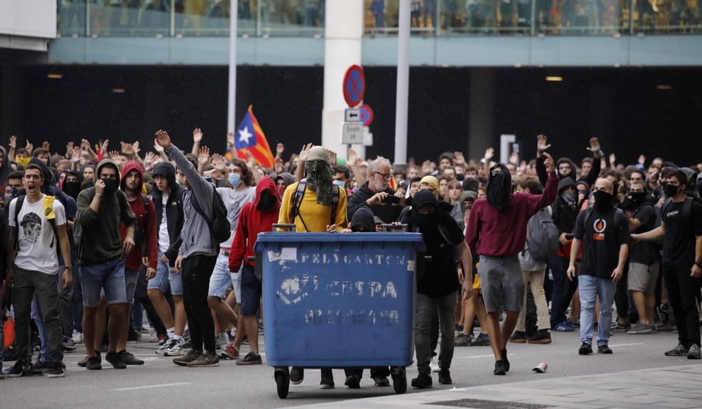 Protesters outside El Prat airport in Barcelona, Spain. Photo: AP