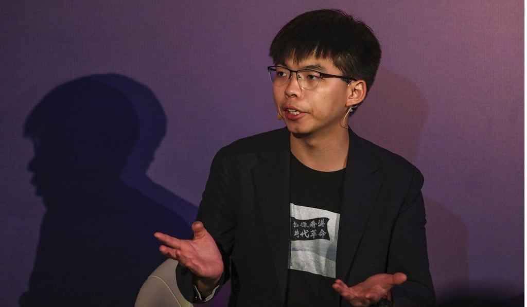 Joshua Wong has been asked some questions by a returning officer. Photo: Xiaomei Chen