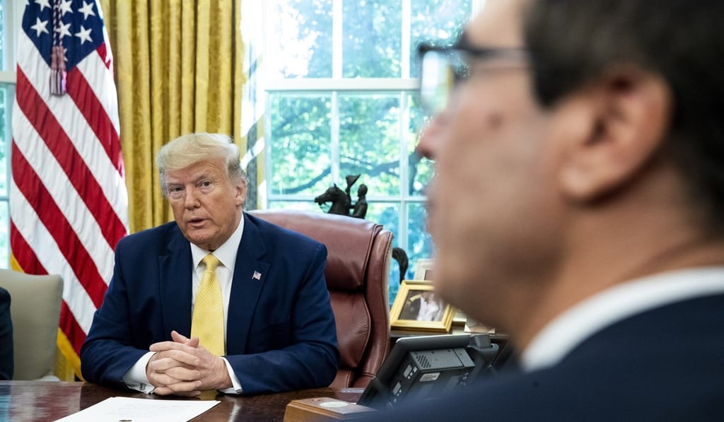 US President Donald Trump listens to US Treasury Secretary Steven Mnuchin speak during a media conference on trade talks with China’s Vice-Premier Liu He in the Oval Office of the White House. Photo: EPA-EFE