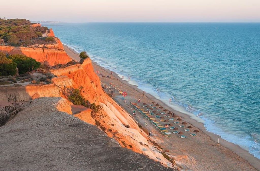 Praia da Rocha Baixinha in Portugal has clear water and is less crowded than other beaches.