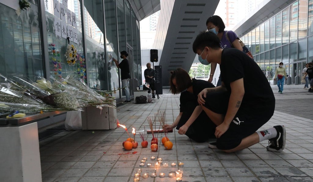 Students wearing black light incense at a makeshift shrine to a student protester at Youth College, Tseung Kwan O, who was found drowned. Photo: Dickson Lee